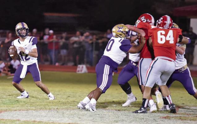 Bucks quarterback Devon Rojo drops back into the pocket looking for an open receiver in last Friday’s game against the Sonora Broncos. Photo courtesy of Noe Lujan