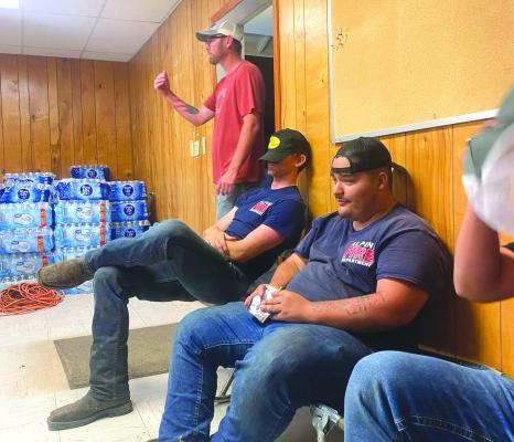 This past Sunday, June 2, the Alpine Volunteer Fire Department responded to the tornado that descended upon the town of Sanderson. AVFD sent three members of their team along with one apparatus full of supplies and water and was just one of several area first responders to render aid to the town Sunday night. Pictured are members of the AVFD resting between jobs before they arrived back in Alpine around 2 a.m. Monday morning.