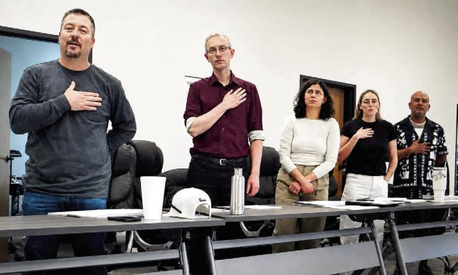 The Marfa City Council stands for the Pledge of Allegiance during last Thursday’s regular meeting. From left are Mayor Pro-Tem Mark Cash, Councilor Travis Acreman, Councilor Emily Kolb, Councilor Katy Kowal, and Councilor Raul Lara. Avalanche photo