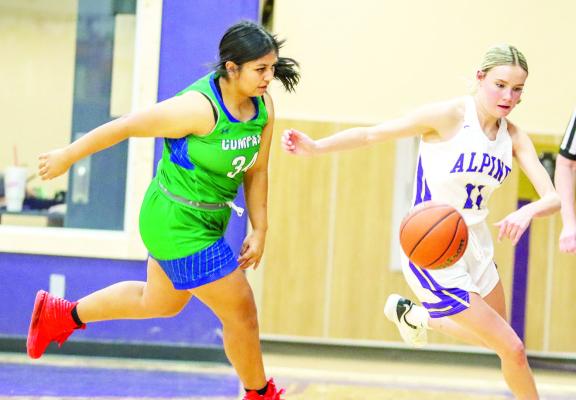 Ali Maroney steals the ball away from a Compass defender, Friday night. By Shawn Yorks