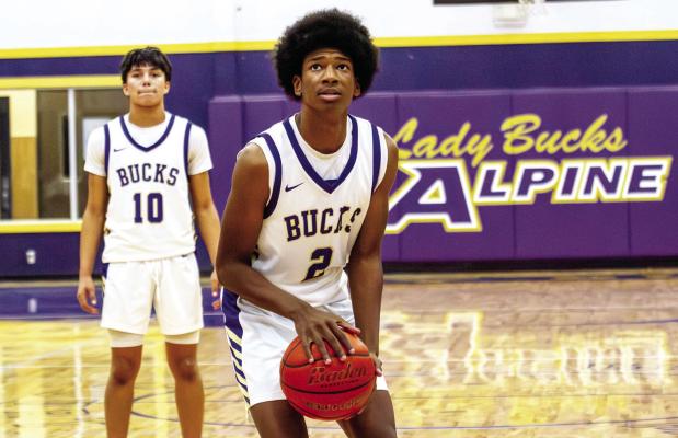 Tae Hardwick prepares to sink a free throw after getting fouled, as teammate Thaddeus Prieto looks on and prepares for defensive play. Photo by Kara Gerbert