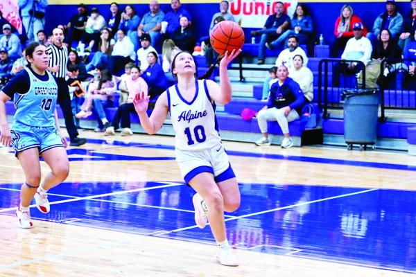 Karo Castillo heads for a layup against Greenwood Tuesday night at the Wilson- Stice court. Photo by Felipe Fierro