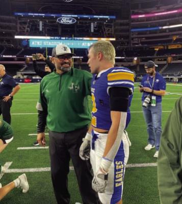 Benito ’Ben’Gallego, former Alpine High School Buck, All Stater and coach of the Franklin Lions, celebrates a back to back state title win at AT&amp;T Stadium on Dec. 15. The Franklin Lions beat Brock 17-14 to defend their 2021 state title. This was Franklin’s third consecutive trip to the state championship. Also pictured is the grandson of a former Alpine elementary teacher Terry Chandler, whose grandson plays for Brock. Courtesy photo