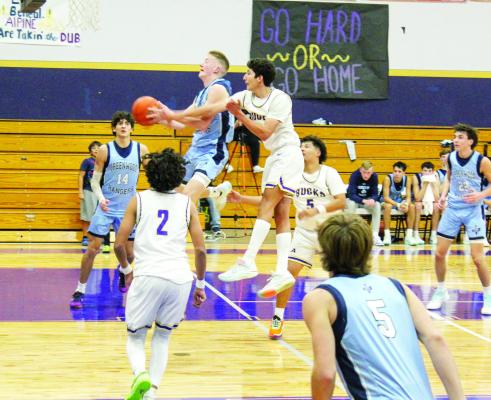 Jace Canaba blocks a Greenwood player during Tuesday’s home victory. The Fightin’ Bucks defeated Greenwood 84-63.