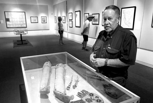 Matt Walter co-curated Museum of the Big Bend’s current exhibit of Edward S. Curtis photographs, historic American maps, and Native American artifacts, all from the museum’s own collections. Photo by Shawna Graves