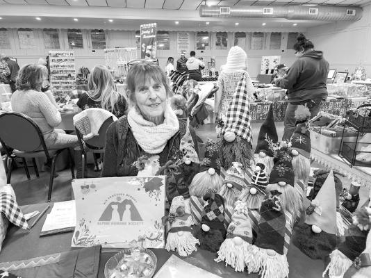 Karen Collins sells her hand crafted Christmas gnomes to benefit the Alpine Humane Society at Saturday’s Mountain Country Christmas bazaar held at the Alpine Civic Center. Avalanche photos by Kara Gerbert