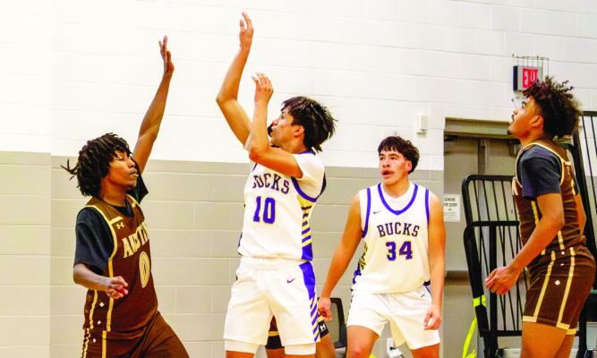 Thaddeus Prieto launches the ball towards the basket in Friday’s match-up against El Paso Austin during the Monahans tournament. Photo by Kara Gerbert