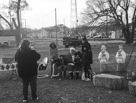 Santa visited with kids and posed for photos recently during the Historic Murphy Street’s Feliz Navidad event. Photo by Joh Covington