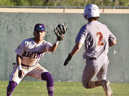 Iden Lujan stands ready to tag out a Kermit player. Photo by Felipe Fierro
