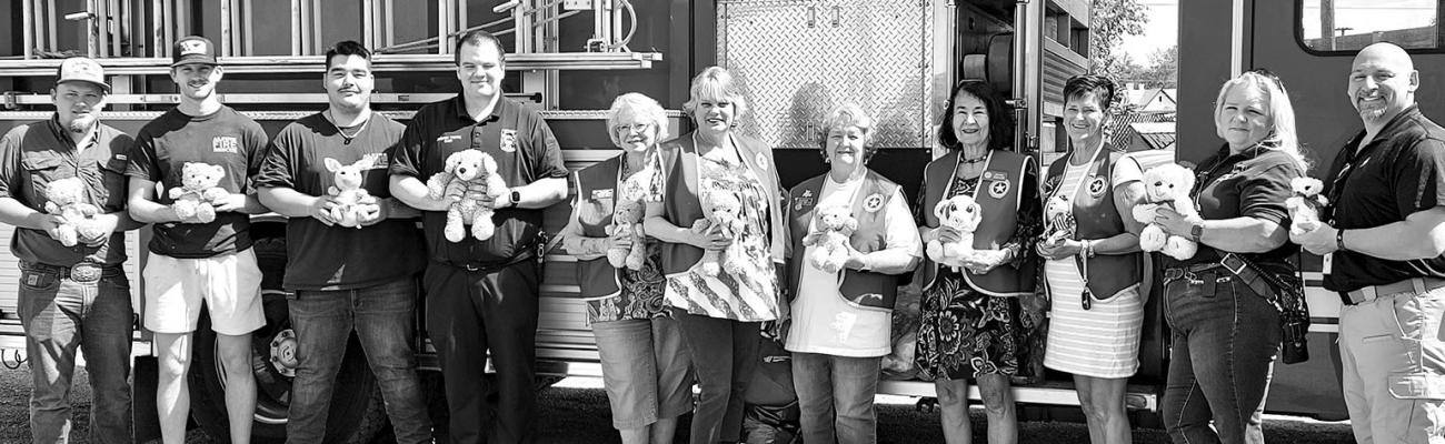 The American Legion Big Bend Post 79 Auxiliary donated stuffed teddy bears and other stuffed animals to the Alpine Volunteer Fire Department on Friday. These are to be given out to children during traumatic events such as fires and vehicle collisions. Pictured from left are Ethan Sullivan, Colby Nunn, Jeremiah Pearce, Chief Andrew Pierce, Sara Herman, Denna Parham, Linda McAnally, Sara Bow, Judy Stokes, Julie Worden, and James Etchison.
