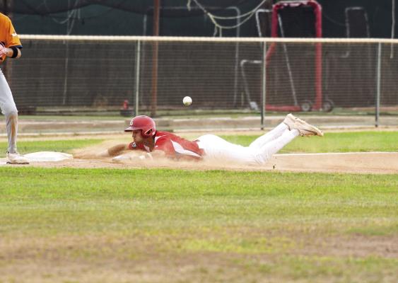Nathan Mix slides into third to beat the tag at Kokernot Field. Photo by Julie Myers