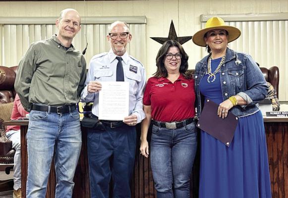 Alpine Mayor Catherine Eaves presented a proclamation to the Alpine Tourism Department recognizing the department’s vital economic and cultural role in support of Alpine’s designation as a Tourism Friendly Community. From left are Chris Ruggia, Jory Vanderburg, Mayor Catherine Eaves, and Heather Yadon. Photo by J.T. Maroney
