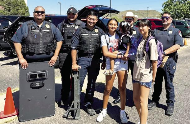 Officers from the Alpine Police Department took part in meeting with local students during Big Bend Regional Medical Center’s backpack giveaway. Photo courtesy of Alpine Police Department