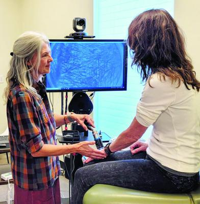 Holly Olds and Marci Roberts take a look at the high-tech instruments used at the Marathon Health Center. Avalanche photo by Roxanne Hill