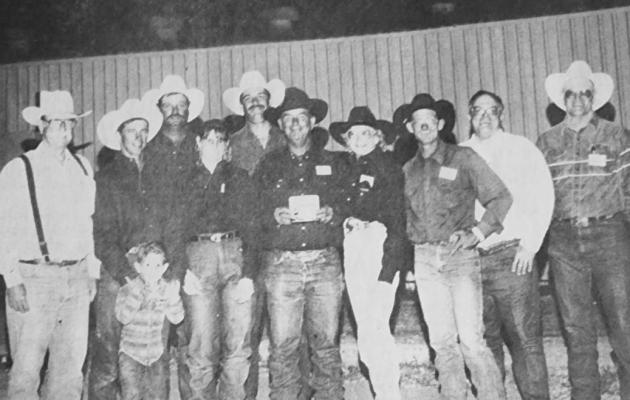 June 24, 1993 The Big Bend Ranch Rodeo team spent time in San Angelo at the San Angelo Stock Show and Rodeo. They are pictured here with SASSR president Charles Probrandt. Team members from left are Curtis Evans and Little Curtis, Stormy Pruitt, Shelly Evans, Rick McIvor, coach Apache Adams, Joy Adams, David Adams, and two other officials of the rodeo.