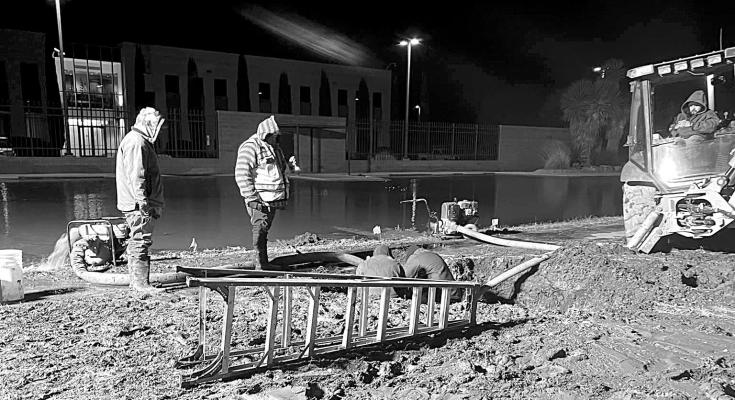 Christmas night saw City of Alpine crews working hard to repair a water main break that occurred in front of the federal building. Courtesy photo