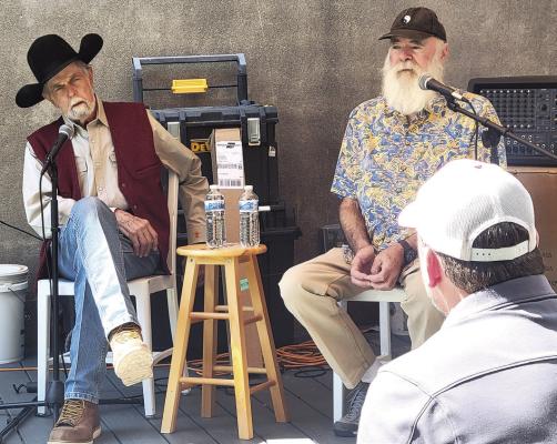 Master luthiers Michael Stevens (left) and Michael Turko answer questions from Far West Guitar’s owner Will Snodgrass during a Saturday speaking event in the courtyard at Far West Guitars as part of Viva Big Bend and the Smithsonian Institution’s Spark! Places of Innovation program. Photo by Kerry Laird