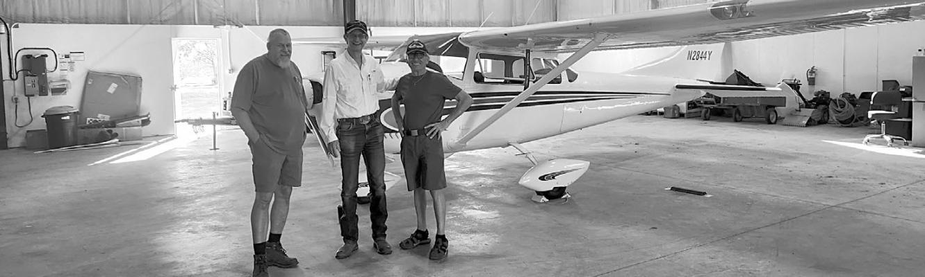 Ward 5 city councilman Rick Stephens show local aviation enthusiasts around the Alpine Casparis Airport to admire aircraft, enjoy coffee and donuts, and talk shop during National Aviation Day. Photo by Joh Covington