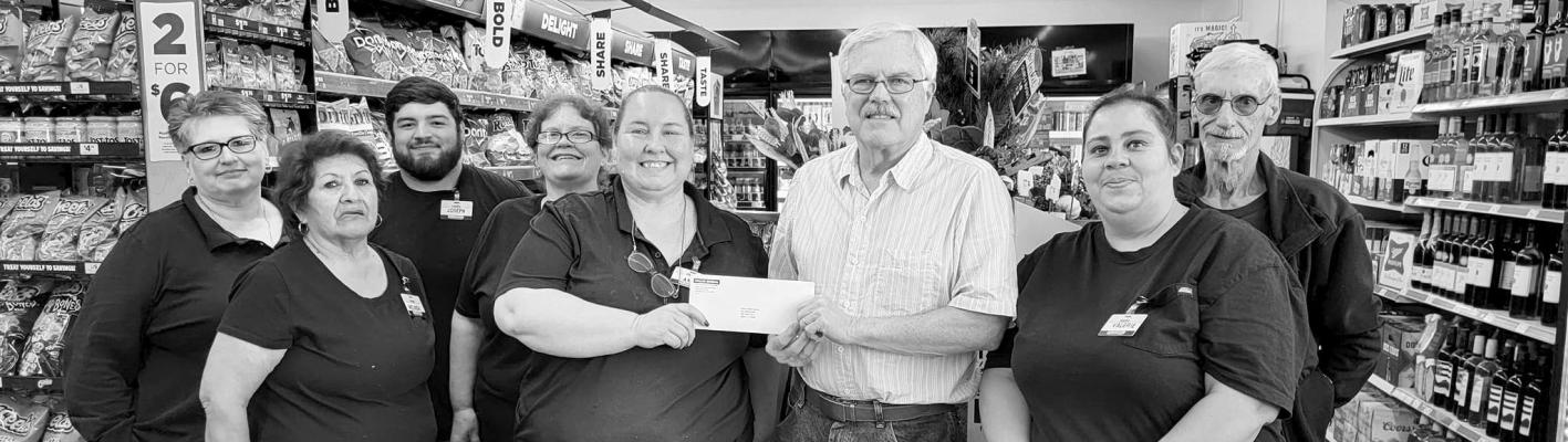 On Oct. 20 employees from Dollar General Melinda Hinojos, Hermelinda Ramirez, store manager Amy Webb, Valerie Anchondo, Joseph Araujo, Kerry Roark, and Billy Beggs presented Alpine Public Library Director Don Wetterauer with a $5,000 check on behalf of the Dollar General Literacy Foundation. The foundation promotes literacy for all ages, summer reading programs, and more. Avalanche photo by Roxanne Hill