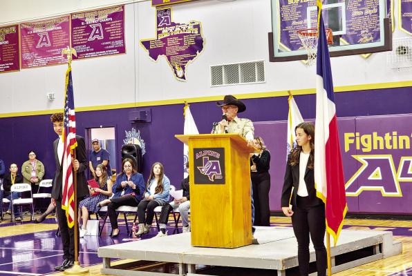 Veteran and Brewster County Sheriff’s deputy Joel Nelson gave the Veteran’s Day program address at Alpine High School’s annual Veteran’s Day celebration on Friday. Nelson paid tribute to fallen comrades who served in Vietnam and whose names now rest on the Vietnam Memorial Wall in Washington, D.C. Photo by Kara Gerbert