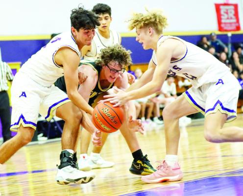 Devon Rojo and Logan Smith battle for the ball in a recent game against Andrews at home.
