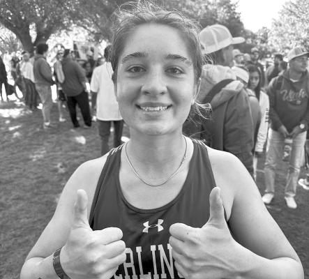 Brooke Jenks gives a thumbs up aftercompleting the 1Astate cross-country course in Round Rock. Courtesy photo