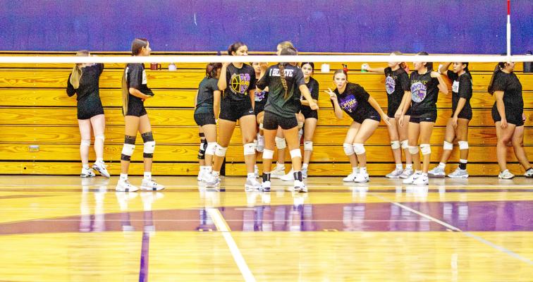 The Lady Bucks take a water break and pose for the camera during an afternoon practice at the Buck Dome. Avalanche photo