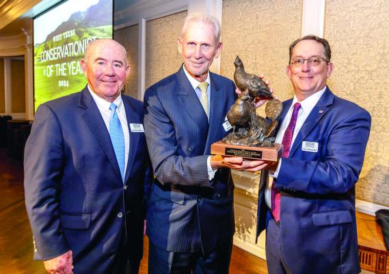John B. Pointdexter, owner of Cibolo Creek Ranch in Presidio County was recently named West Texas Conservationist of the Year thanks to his collaborative efforts with the Borderlands Research Institute (BRI.) Pictured with Pointdexter receiving the award is BRI Advisory Board Chairman Dan Allen Hughes and the presenter is BRI Director Dr. Louis Harveson. Courtesy photo
