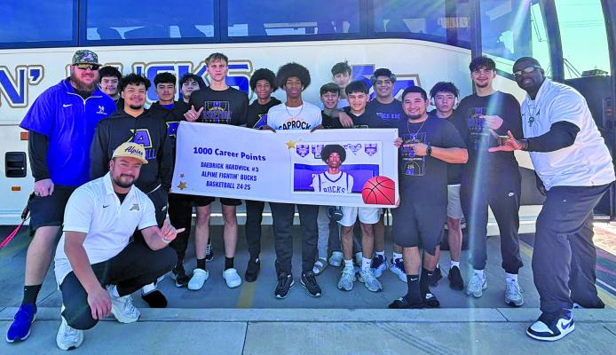 A milestone usually only achieved as a senior, Alpine High School junior Dae Hardwick continues reaching for greatness as an athlete after attaining 1,000 career points in basketball. Hardwick’s goal is to reach 2,000 before he graduates next year. He is pictured here with his teammates and coaches. Courtesy photo