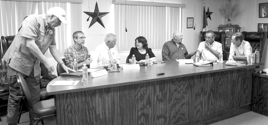 The Brewster County Commissioners Court joined Alpine City Council in the city chambers on Tuesday for a joint workshop regarding the Texas Department of Transportation’s railroad bridge safety concerns. Pictured left to right, Pct 1 Commissioner Jim Westermann, Council Member Darin Nance, Brewster County Judge Greg Henington, Mayor Catherine Eaves, Pct 4 Commissioner Mo Morrow, and Council Members Martin Sandate and Rick Stephens.