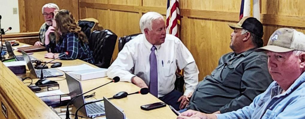 County commissioners discuss matters with one another after the recent court meeting on Tuesday. Pictured, right to left, commissioners Jim Westermann Pct. 1, Sara Colando Pct. 2, Brewster County Judge Greg Henington, and commissioners Ruben Ortega Pct. 3, and Mo Morrow Pct. 4. Photo by Joh Covington