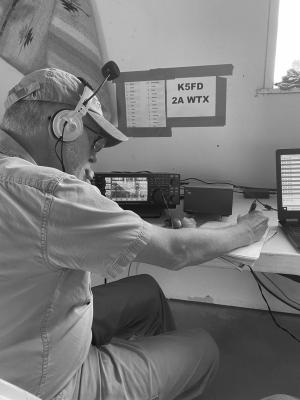 Jim Fowler, a local Ham Radio operator participates in last year’s nationwide on-air event. Fowler is operating a voice transceiver radio during the annual Field Day.