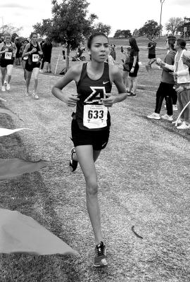 Emy Hernandez rounds a curve on the crosscountry course at Mae Simmons Park in Lubbock during this past Saturday’s Regional competition. Courtesy photo