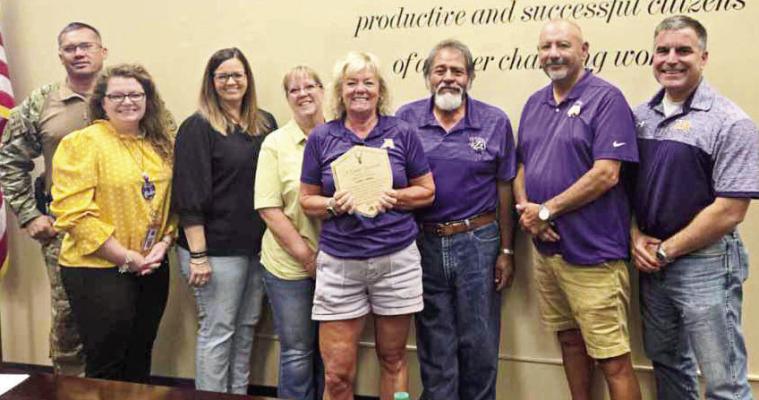 Alpine ISD trustee Mary McCallister was presented a plaque for her 11 years of service on the Alpine ISD Board of Trustees last Wednesday. McCallister (center) is pictured with the board that includes Jimmy Morris, AISD Superintendent Dr. Michelle Rinehart, Haley Babb, Nicki Ahrens, Eddie Natera, Joe Portillo, and Dr. Adrian Billings. Courtesy photo