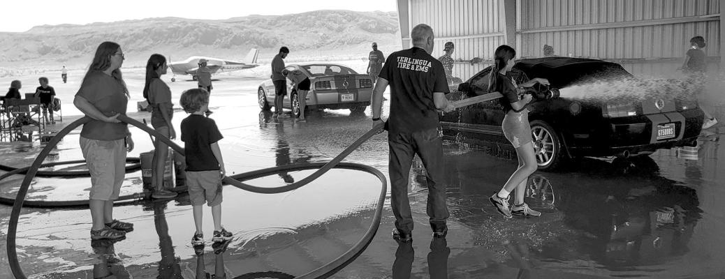 Terlingua students and Terlingua Fire and EMS wash Shelby Mustangs at the group’s gathering down South this past weekend. Courtesy pho