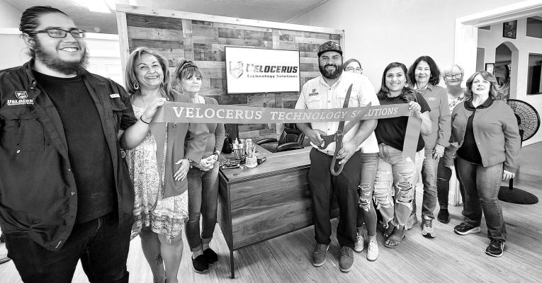 The Alpine Ambassadors celebrated the grand opening of Velocerus Technology Solutions last Thursday evening with owner Aaron Rodriguez. Pictured are Jacob Sanchez, Eva Olivas, Dona Ward, Aaron Rodriguez, Jade Spear, Savannah Granger, Sarah Bow, Gerri Davis, and Catherine Eaves.