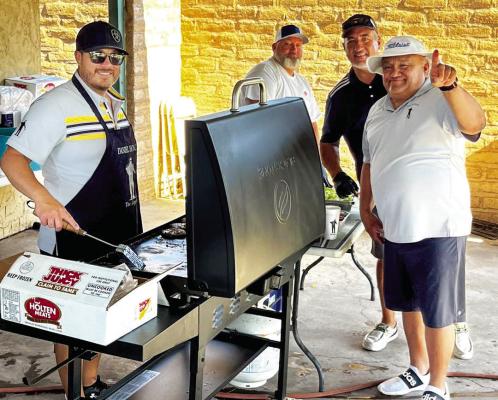 Daniel Holguin mans the grill, while Butch Holley, Tony Molinar, and Jesse Hernandez assist at this past weekend’s Legend’s Golf Tournament held at Alpine Country Club. Courtesy photo