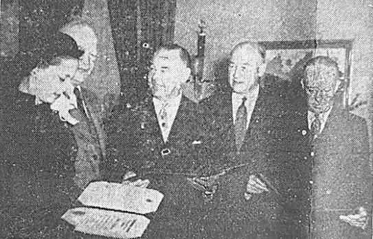 October 23, 1953 President Eisenhower is pictured here with three U.S. Savings Bonds volunteers. At the White House, the president honored the volunteers with a distinguished service award certificate, which symbolizes the nation’s gratitude to the volunteers.