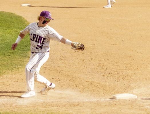 Alex Adams reaches for a ball off the bat of a Yellow Jacket during the Bucks’ District Championship title match, where they defeated Kermit. Photo by Felipe Fierro