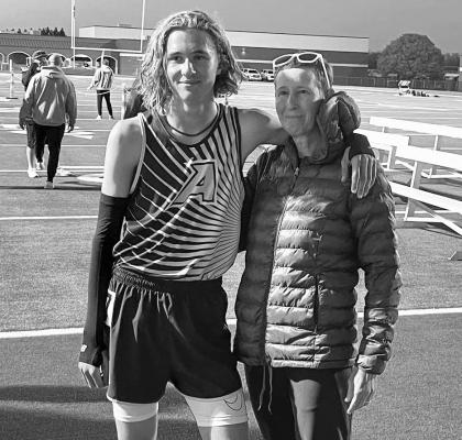 Coach Cory Cason is pictured here with her son Hatfield Cason after a track meet earlier in the year.
