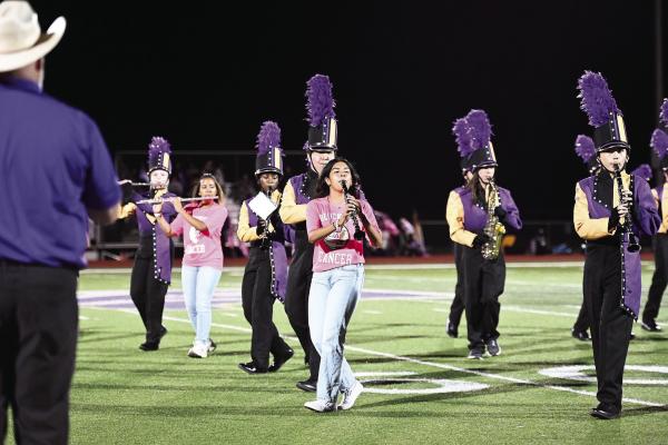 The Alpine Fightin’ Buck Band worked on their marching routine and songs during halftime on Friday night. Photos by Felipe Fierro