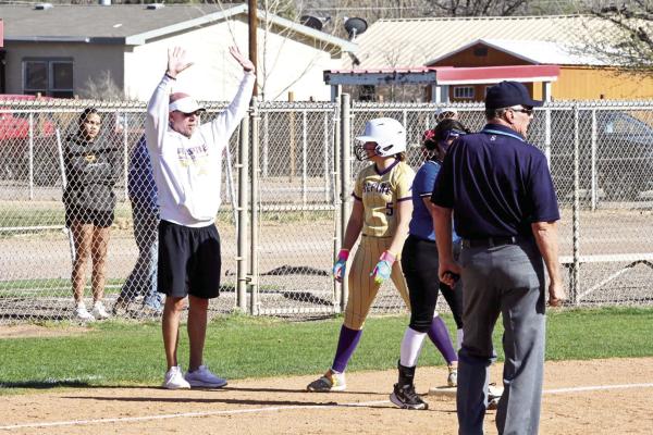 Coach Chris Virdell hit his 100th win as the head coach for the Alpine Lady Bucks softball team in their defeat over Kermit on Friday. Virdell is pictured here giving instructions to his freshman slugger, Kacy Hawkins. Photo by Felipe Fierro