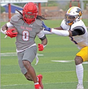 Kendrick Jefferson pulls away from a Wayland Baptist defender during the Lobos defeat of the Pioneers last Saturday Photo by Brylee Sweeten