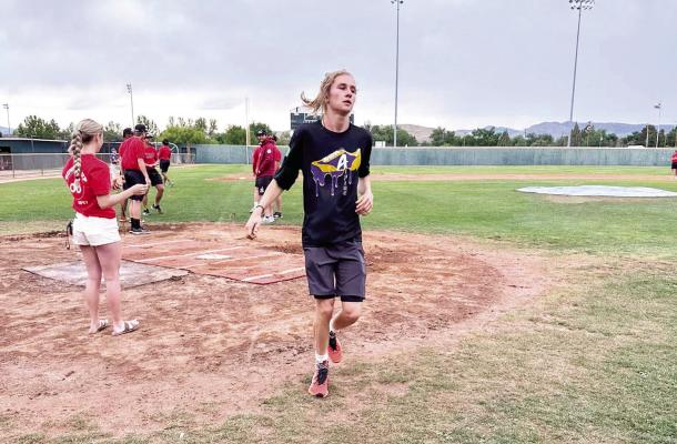 Hatfield Cason crosses the home plate finish line after completing the Alpine Cowboys Home Run 10k this past weekend. Courtesy photo