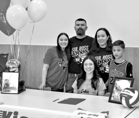Kiara Castillo signed a letter of intent to play volleyball for Sul Ross State University on Tuesday. Kiara is shown here supported by her family. Photo by Felipe Fierro