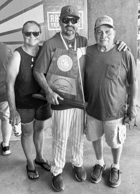 Ben Gallego (center) is pictured here with his parents Linda (left) and B.J. (right) showing off the UIL trophy won by the State Champion Franklin Lions.