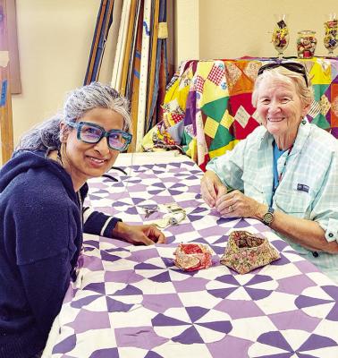 Christelle Bois, director of the Amazon Prime series ‘The Story of Art in America’ is pictured here with local quilter Dot Mainz. Mainz was instructing Bois on the art of hand quilting. Avalanche photo by Kara Gerbert