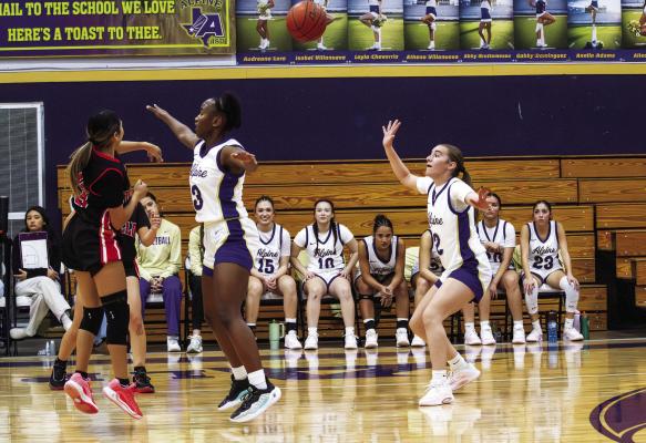 Lady Bucks Shannon Tamale and Evelyn Smith work to block and intercept a pass by Tornillo during last Friday night’s win over the Coyotes. Photo by Kara Gerbert