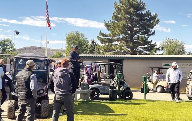 Alpine golfer Rene Ybarra reads the rules of this past weekend’s fundraising golf tournament for the Marathon PTO and Foundation to the participants before they tee off. Courtesy photo