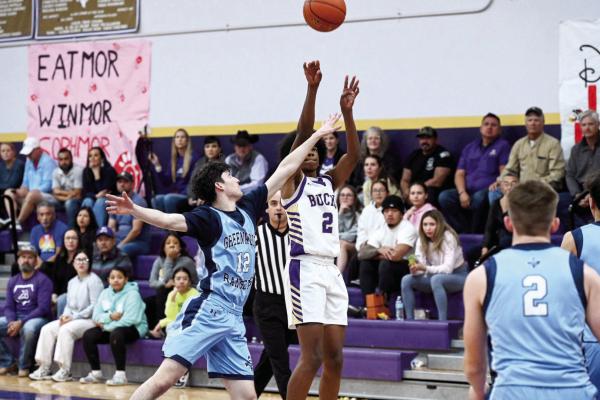 Sophomore Tae Hardwick hits a jumper against Greenwood Tuesday night at the Wilson-Stice court. Photo by Felipe Fierro